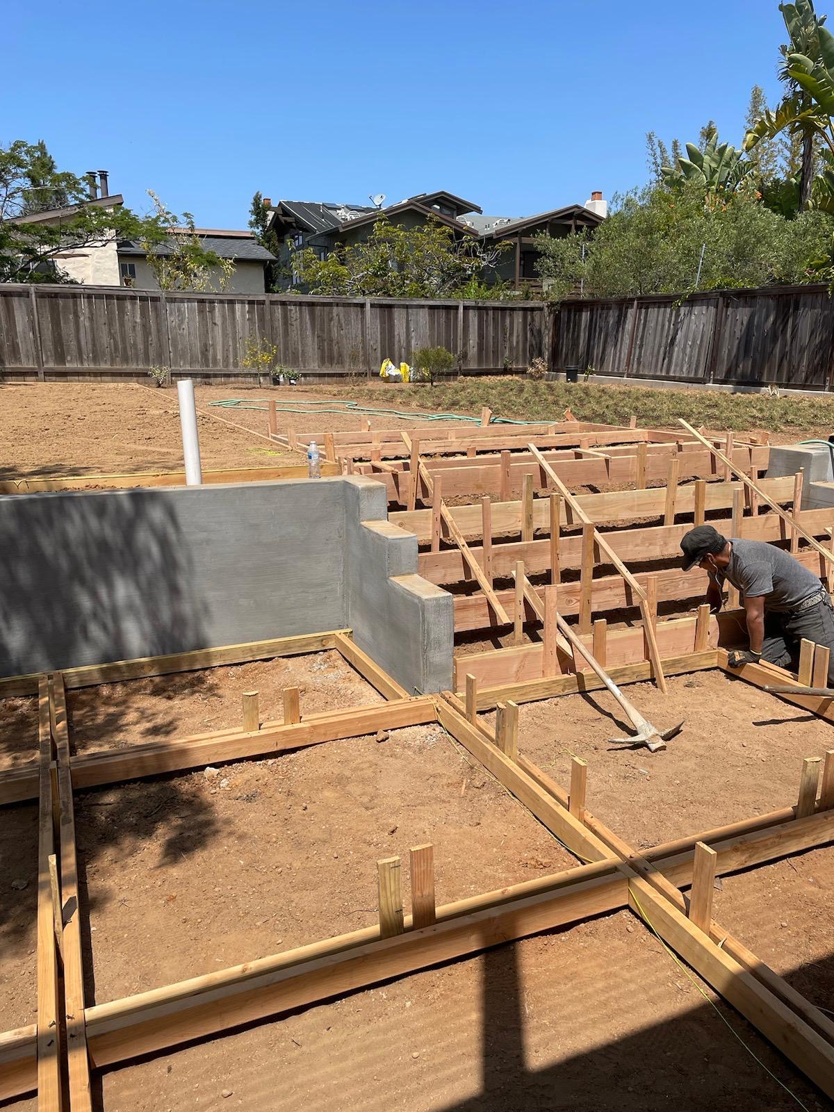 Backyard Concrete & Turf before